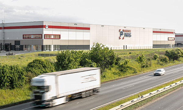 Photo of a truck and a warehouse from the report